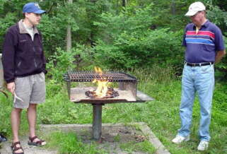 Wes and Bill prepare the grill